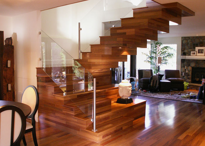 A striking, custom-built teak stairway, providing a real centerpiece for the ground floor